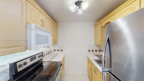 a spacious bathroom with a sink a mirror and a bathtub
