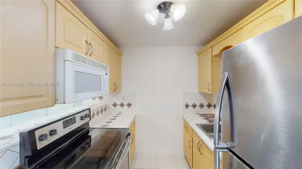 a spacious bathroom with a sink a mirror and a bathtub