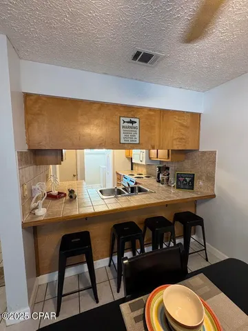 $189,000 | 7125 North Lagoon Drive, Unit H, Panama City, FL 32408