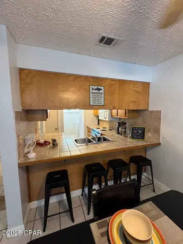 $189,000 | 7125 North Lagoon Drive, Unit H, Panama City, FL 32408