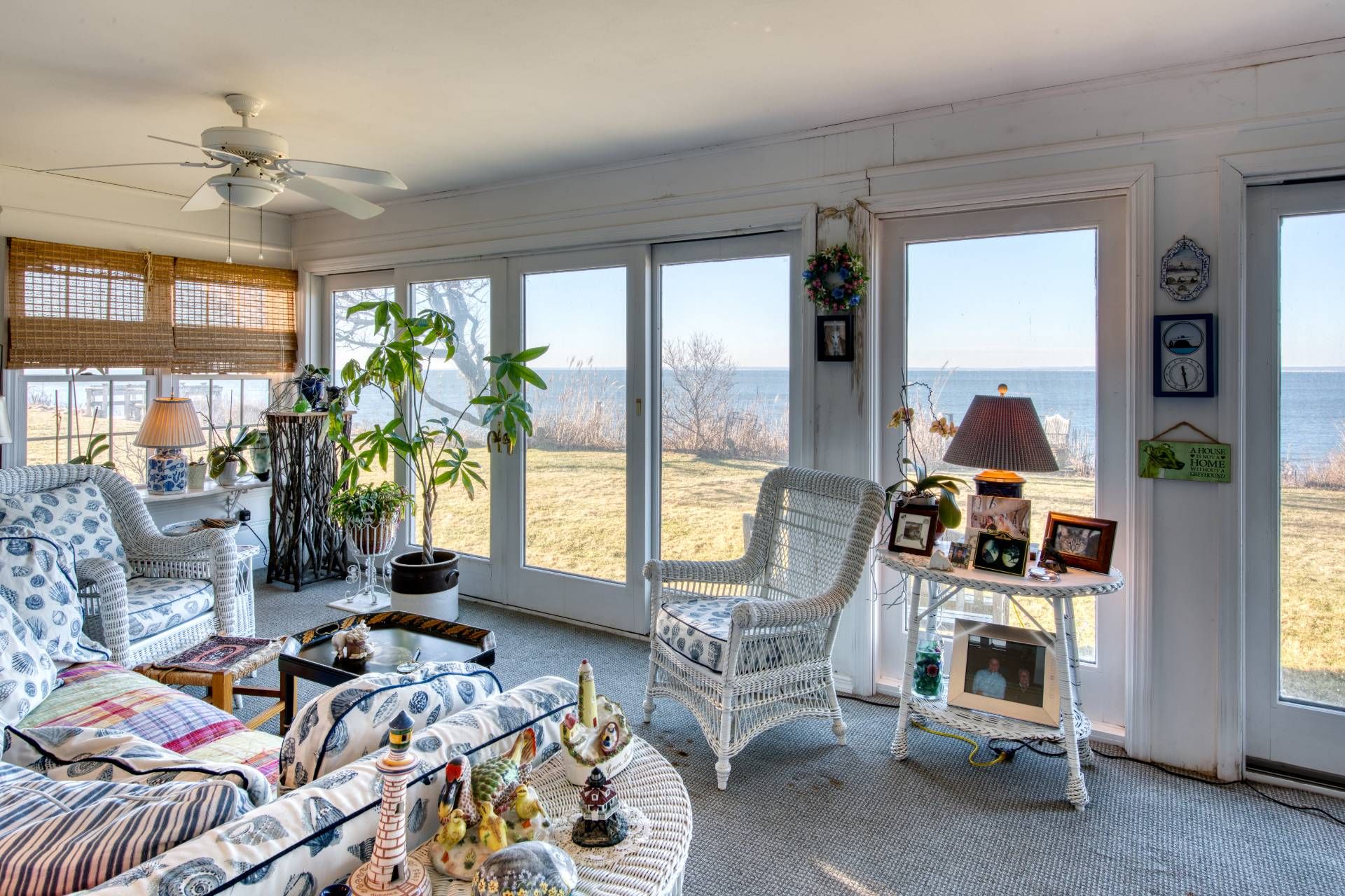 335 Sound View Road Orient, NY 11957 - Photo 15 of 22 a bedroom with furniture and a floor to ceiling window