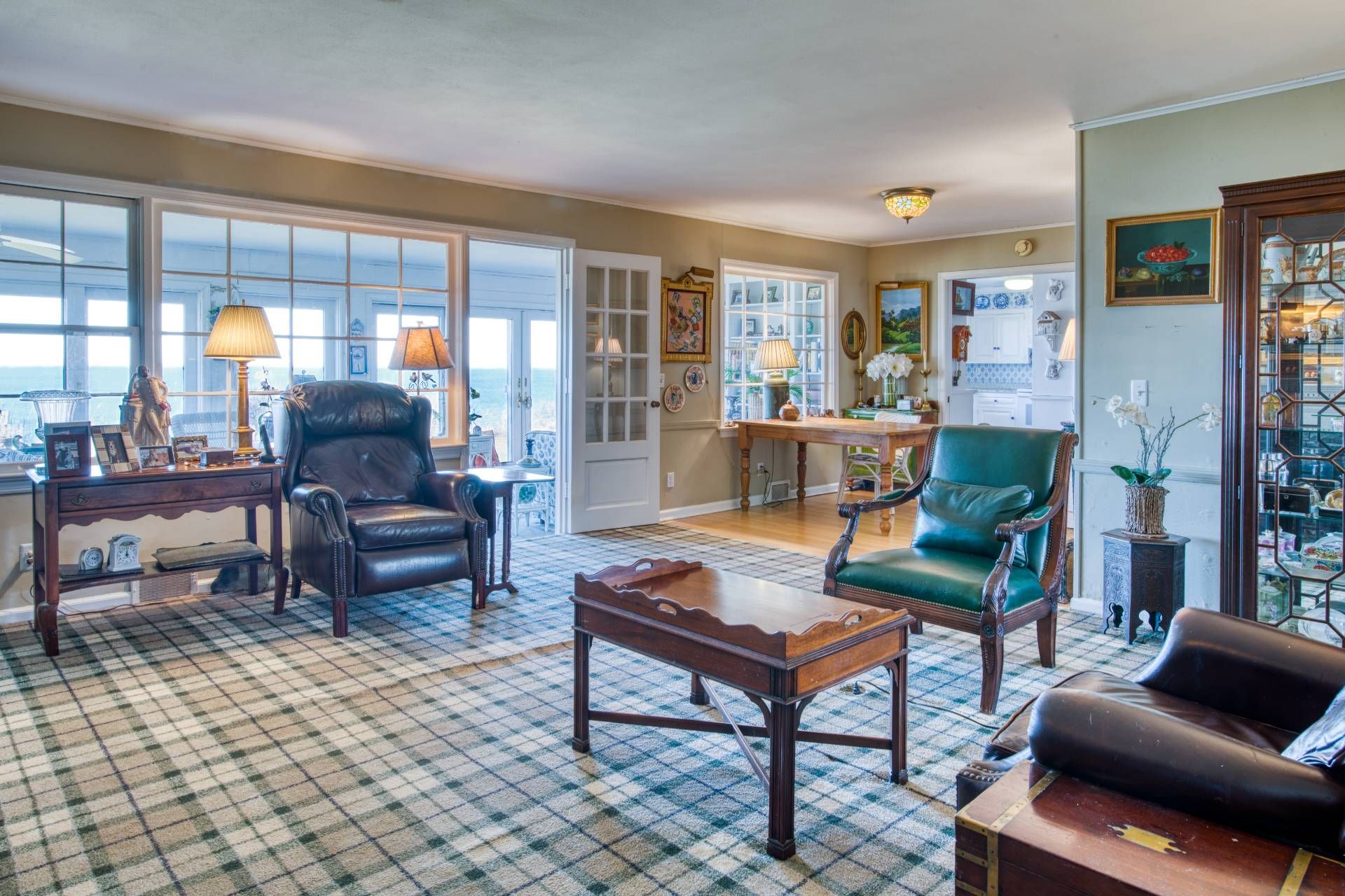 335 Sound View Road Orient, NY 11957 - Photo 18 of 22 a living room with furniture and a floor to ceiling window