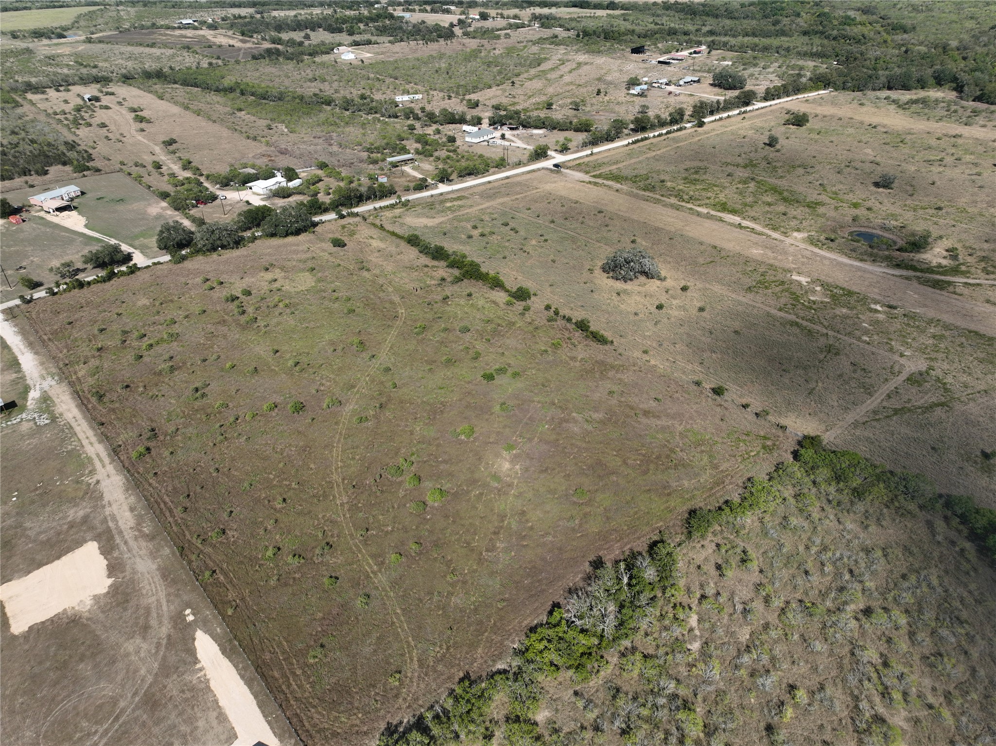 Tbd Lot 6 Tbd Road Dale, TX 78616 - Photo 3 of 11 a view of a dry yard with wooden fence