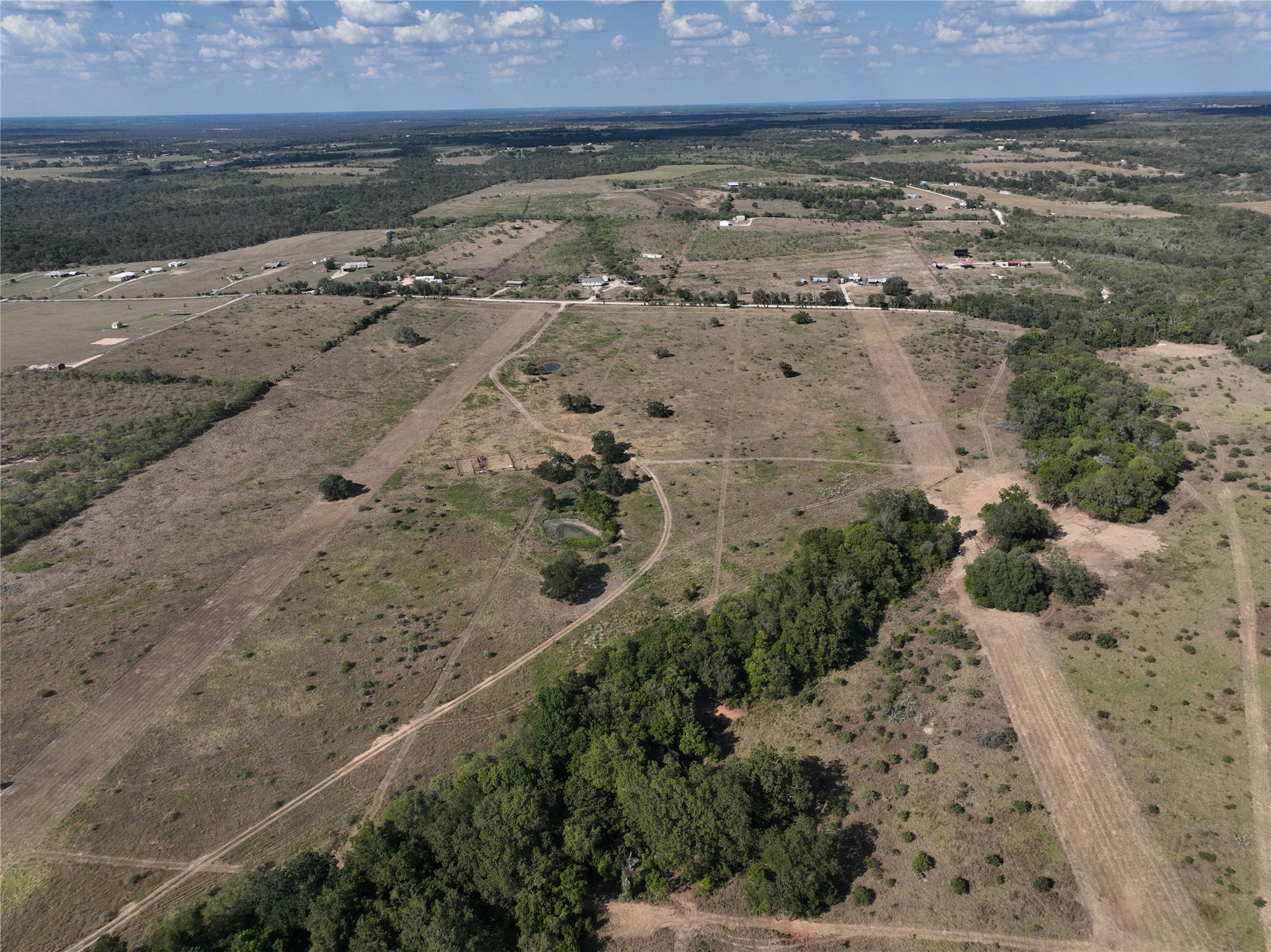 Tbd Lot 6 Tbd Road Dale, TX 78616 - Photo 7 of 11 a view of a lake with a mountain in the background