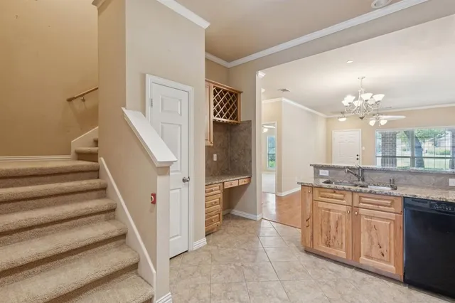 a spacious bathroom with a granite countertop sink a mirror and a shower
