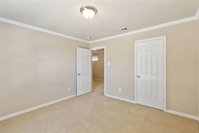 an empty room with closet area