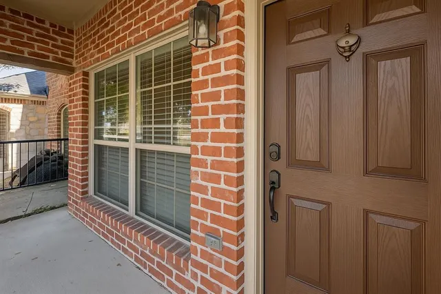 a view of a door and a window