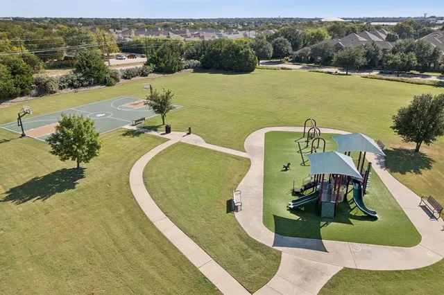 an aerial view of a house with a lake view