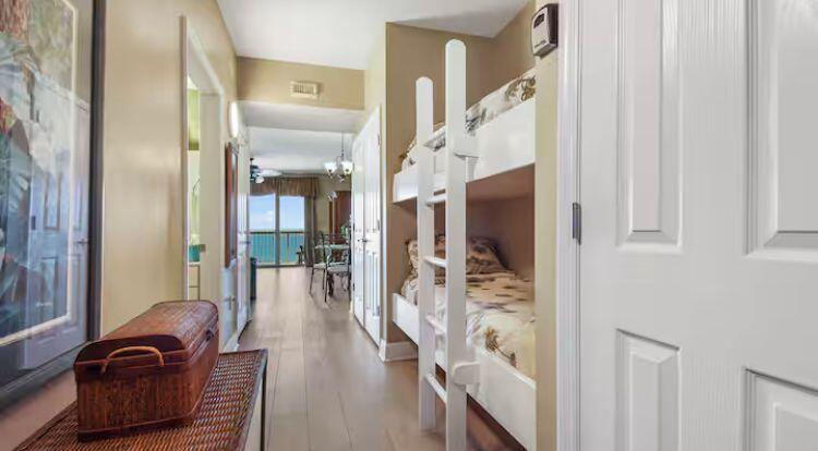 17757 Front Beach Road, Unit 2204D Panama City Beach, FL 32413 - Photo 24 of 32 a view of a hallway with wooden floor windows and livingroom