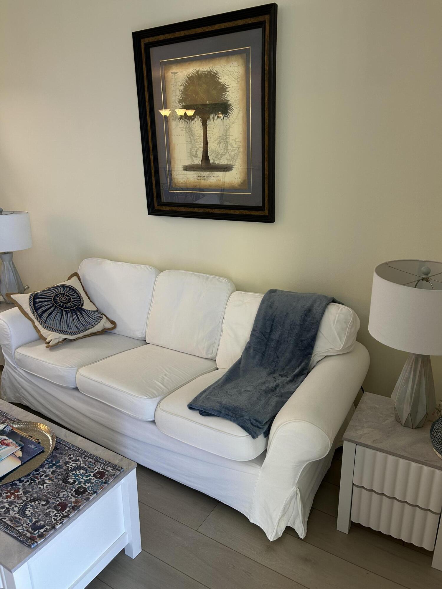 17757 Front Beach Road, Unit 2204D Panama City Beach, FL 32413 - Photo 6 of 32 a living room with furniture and a couch
