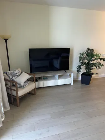 a view of a livingroom with furniture and a ceiling fan