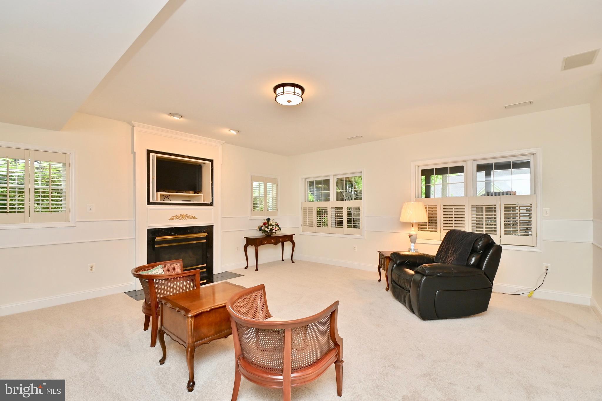 6202 Garden Road Springfield, VA 22152 - Photo 55 of 91 Lower level in law suite Living area with gas FP