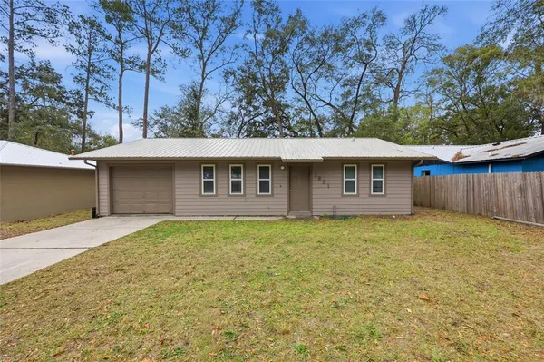 a front view of a house with yard