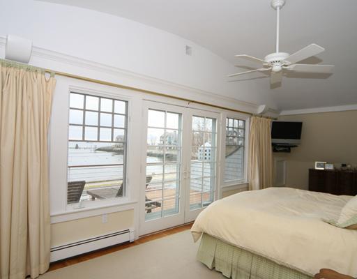 17 Crescent Beach Road Rowayton, CT 06853 - Photo 14 of 19 a bedroom with a large bed and a tv