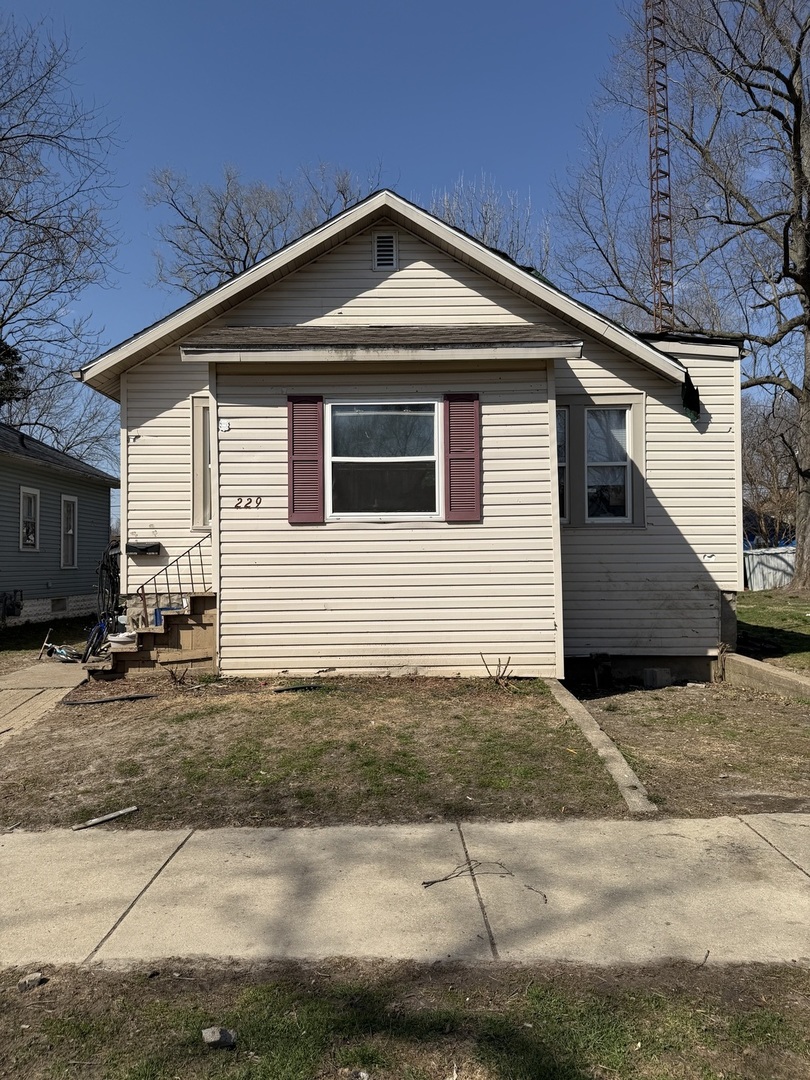 a front view of a house with a garage