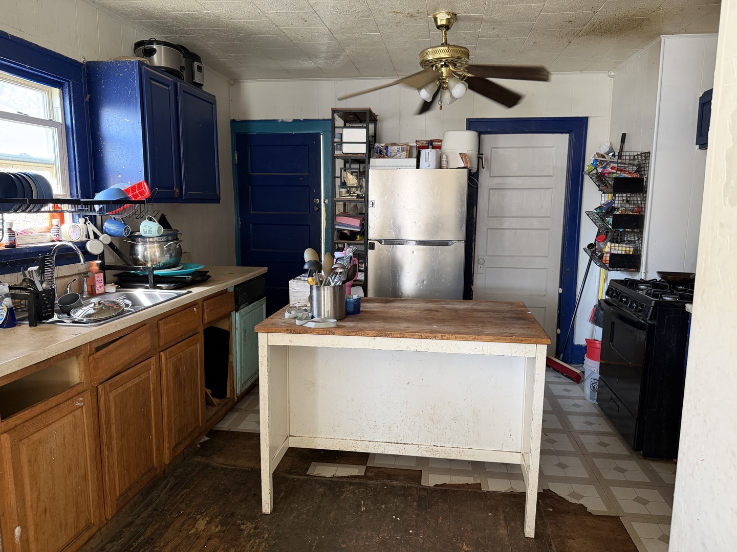 229 North 6th Avenue Kankakee, IL 60901 - Photo 11 of 16 a kitchen with a refrigerator and a sink