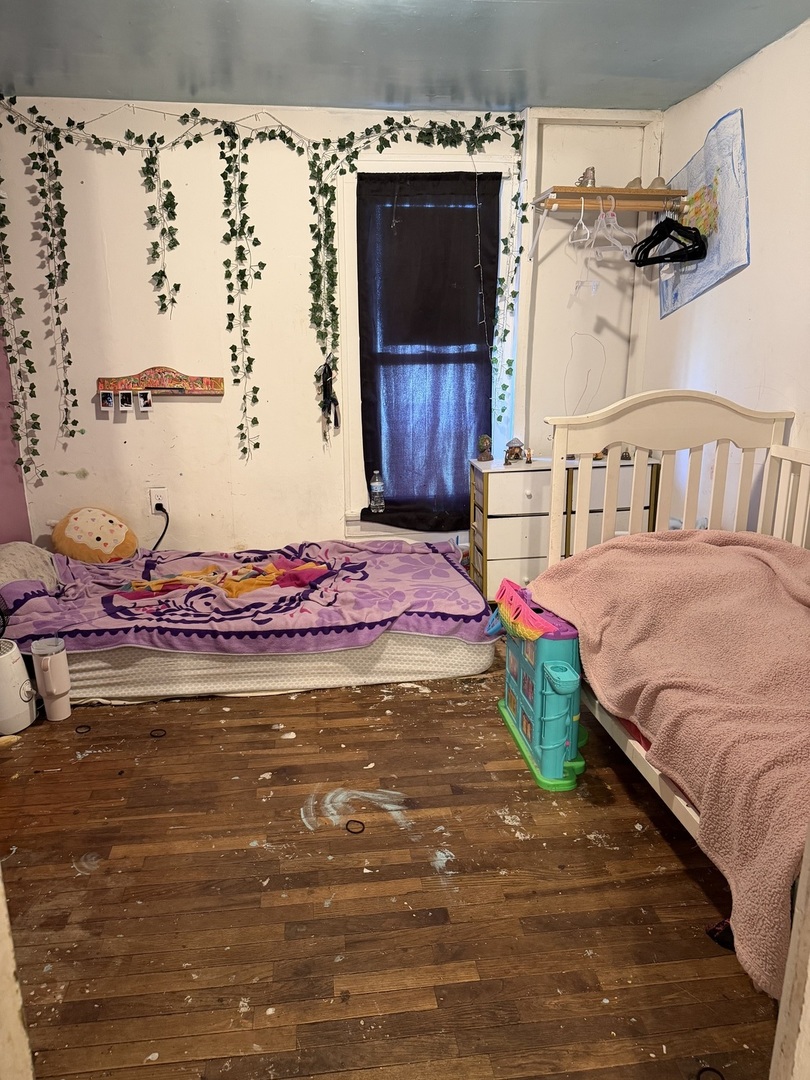 229 North 6th Avenue Kankakee, IL 60901 - Photo 14 of 16 a bedroom with a bed and a window