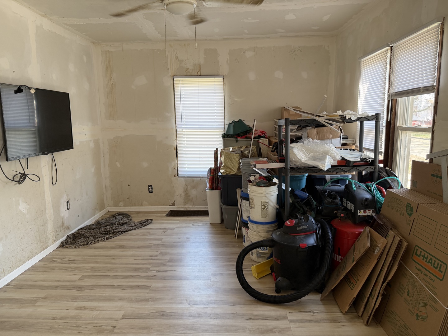 229 North 6th Avenue Kankakee, IL 60901 - Photo 8 of 16 a living room with furniture and a flat screen tv