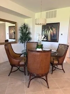 a living room with a couch and a potted plant