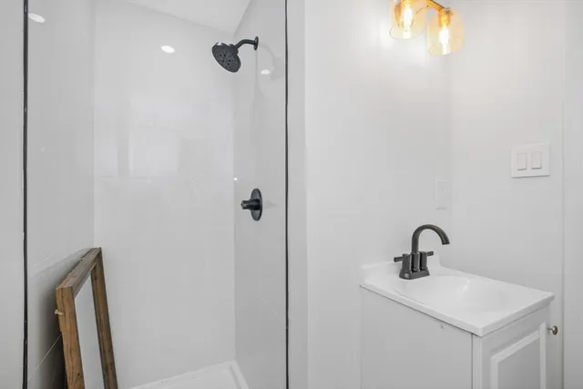 a bathroom with a sink and mirror