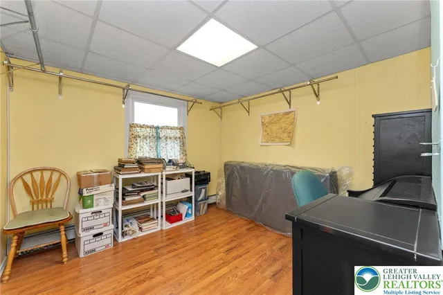 a bed room with a bed and a chair