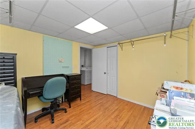 a room with wooden floor and furniture