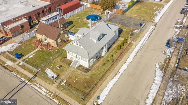 a aerial view of a house with a swimming pool
