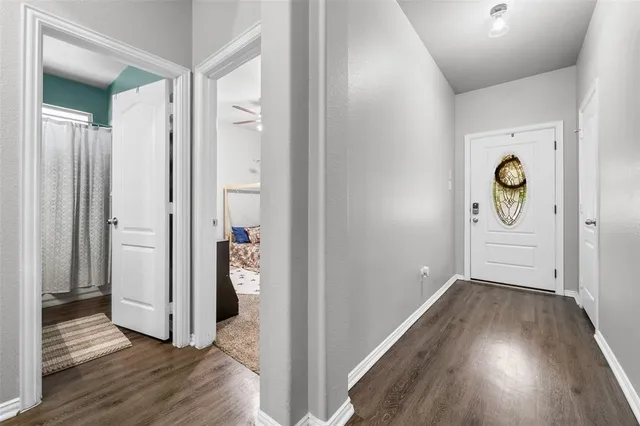a view of an entryway with wooden floor