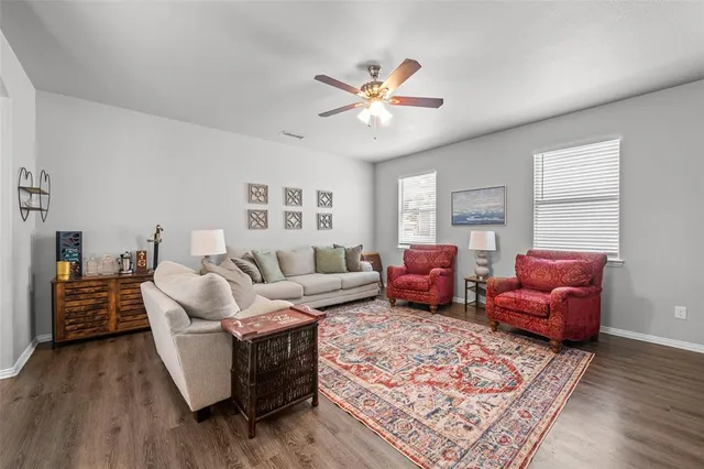 a living room with furniture and a rug