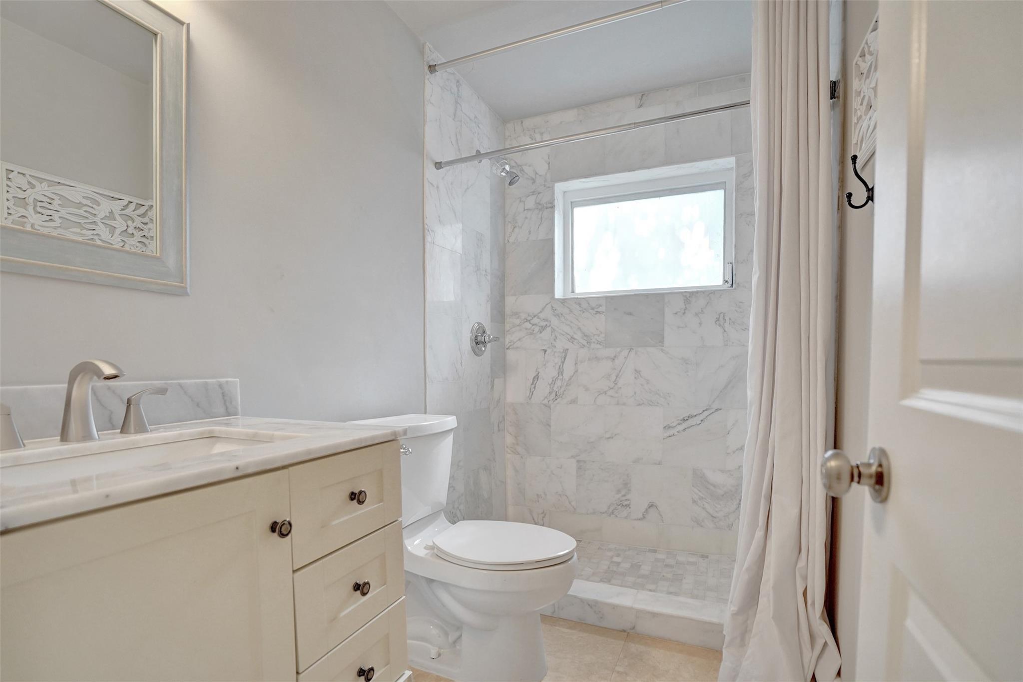 4740 Northeast 21st Terrace Lighthouse Point, FL 33064 - Photo 14 of 28 Updated 2nd bathroom