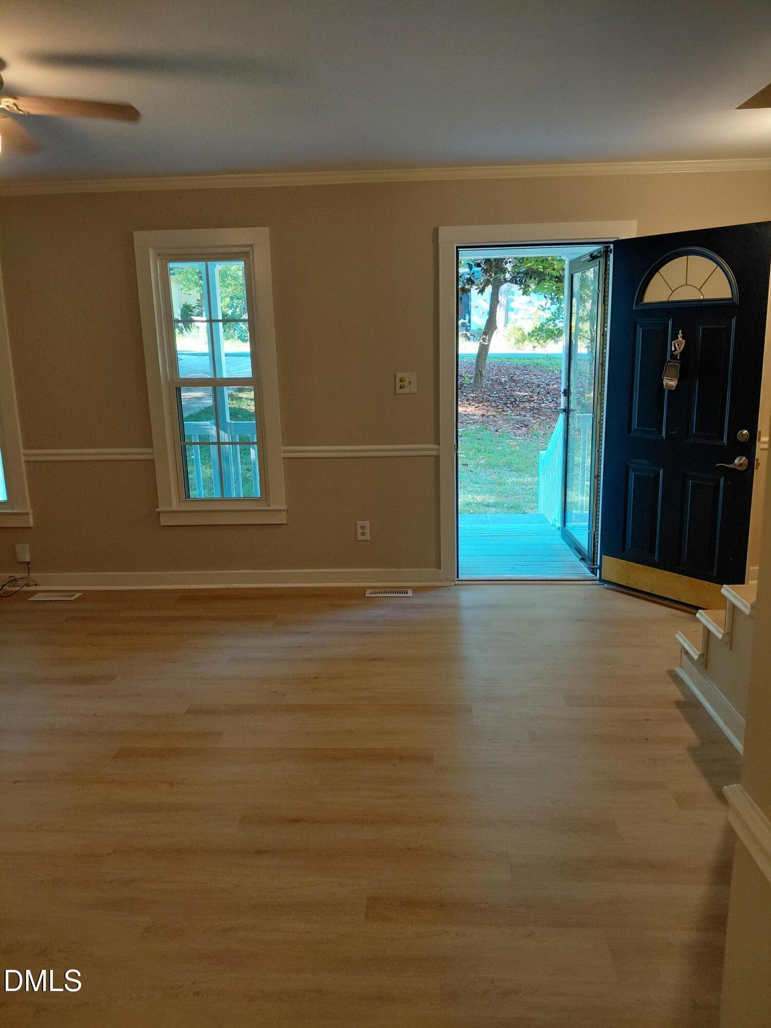 804 Olive Street Apex, NC 27502 - Photo 12 of 60 a view of an empty room with window and bathroom