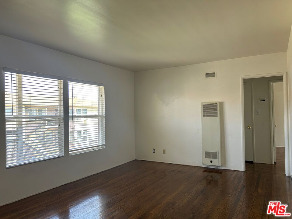 4107 Wade Street, Unit H Los Angeles, CA 90066 - Photo 1 of 16 an empty room with wooden floor and windows