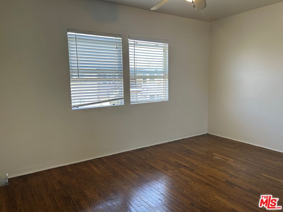 4107 Wade Street, Unit H Los Angeles, CA 90066 - Photo 13 of 16 an empty room with wooden floor and a window