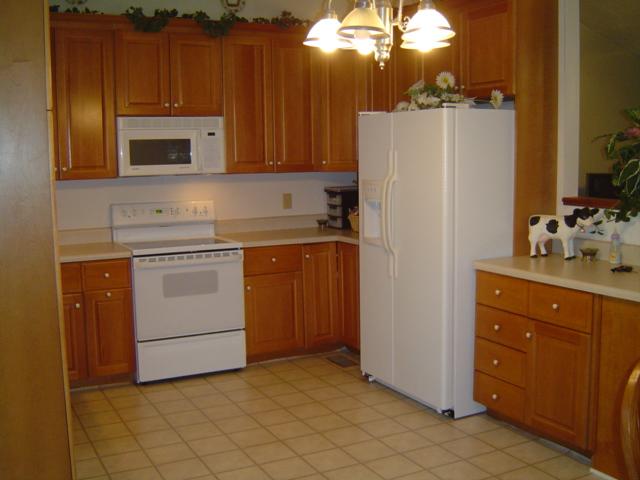 235 Deep Woods Road Hardy, VA 24101 - Photo 2 of 10 a kitchen with a refrigerator sink and cabinets