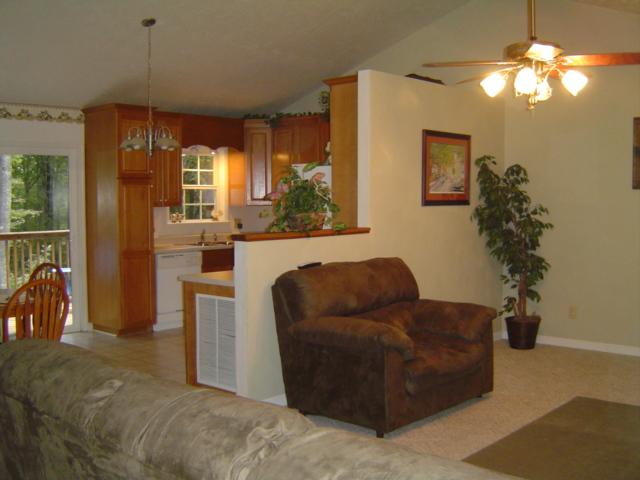 235 Deep Woods Road Hardy, VA 24101 - Photo 4 of 10 a living room with furniture and a chandelier