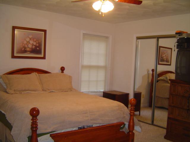 235 Deep Woods Road Hardy, VA 24101 - Photo 5 of 10 a bedroom with a bed and a dresser