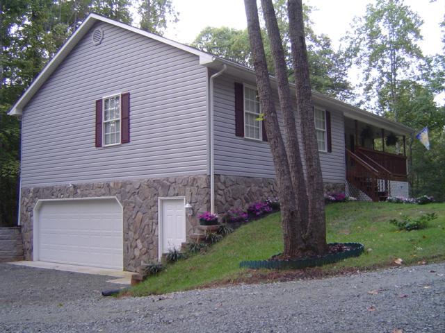 235 Deep Woods Road Hardy, VA 24101 - Photo 8 of 10 a front view of a house with garden