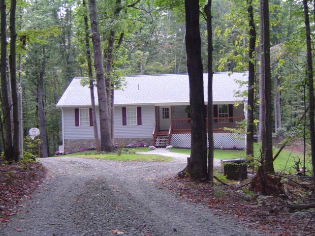 235 Deep Woods Road Hardy, VA 24101 - Photo 9 of 10 a front view of a house with garden