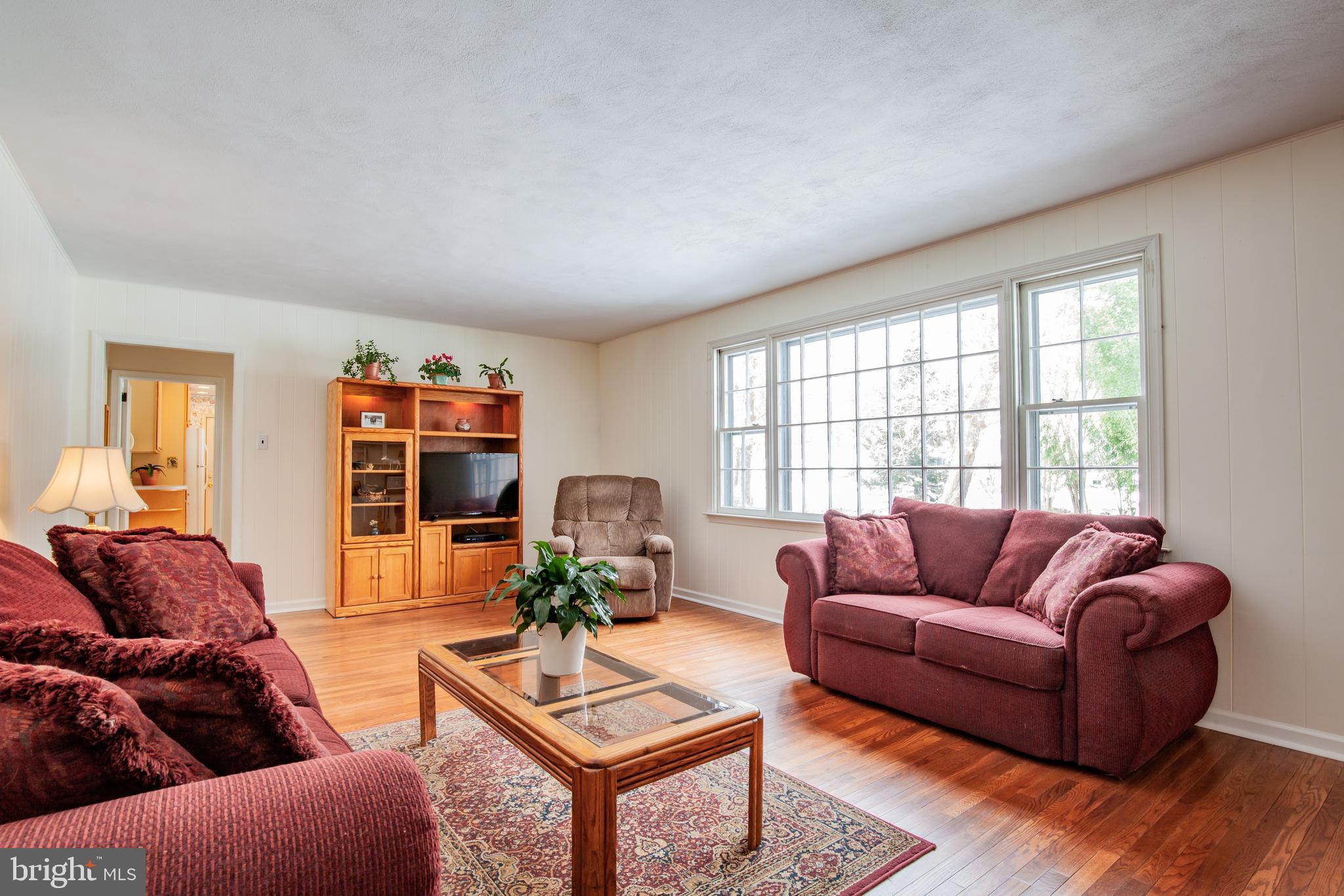 771 Richards Road Wayne, PA 19087 - Photo 13 of 41 a living room with furniture a rug and a large window