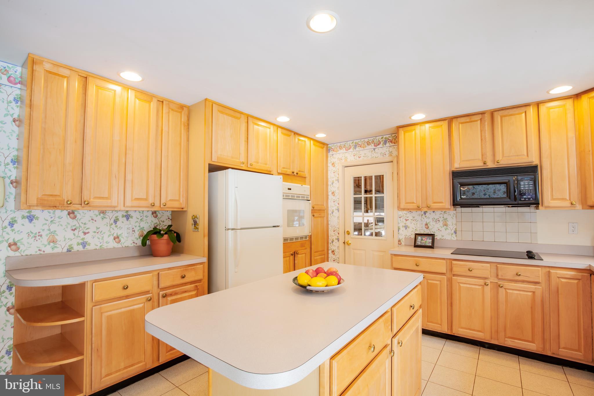 771 Richards Road Wayne, PA 19087 - Photo 17 of 41 a kitchen with a sink a stove and white cabinets