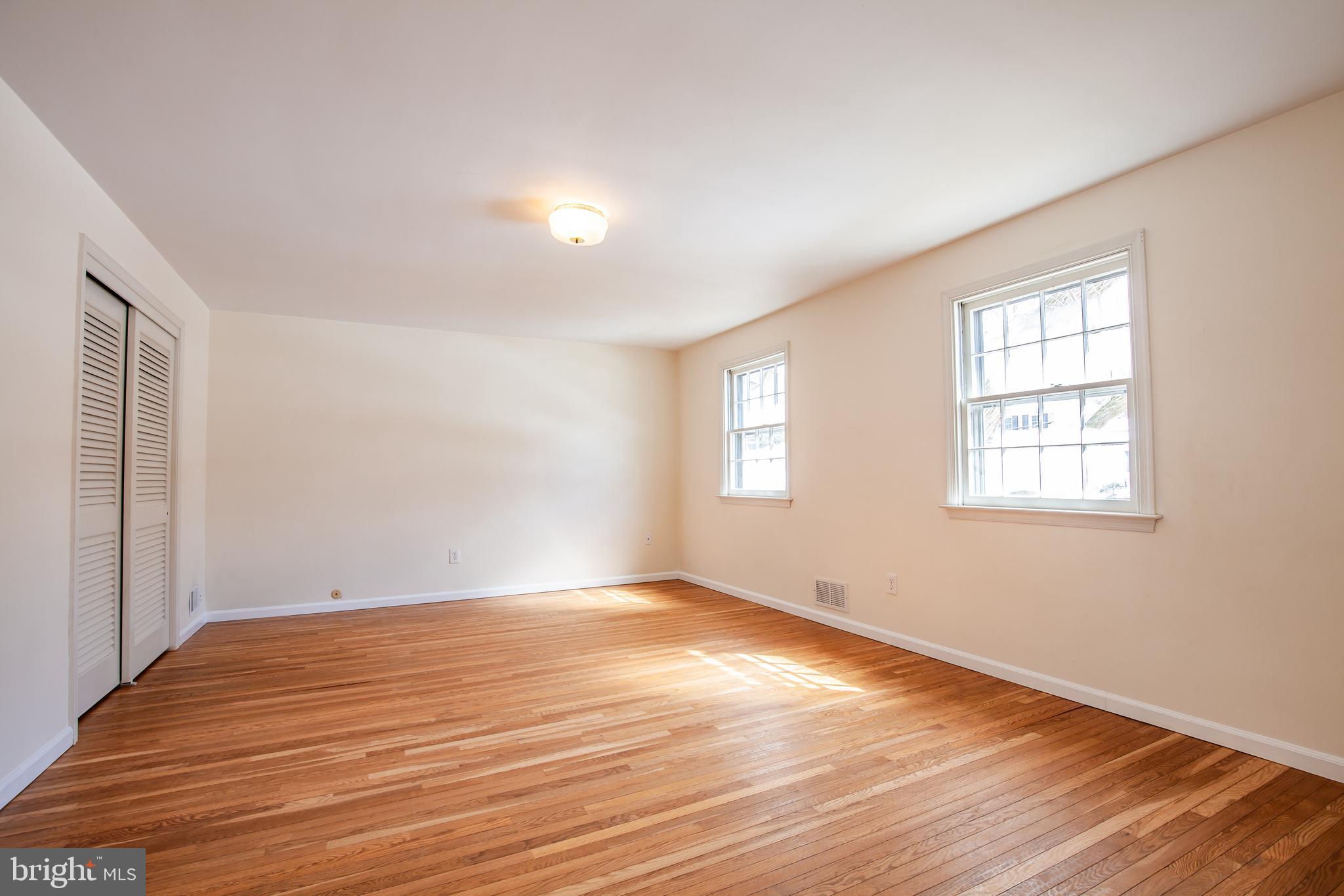 771 Richards Road Wayne, PA 19087 - Photo 22 of 41 a view of empty room with wooden floor and fan
