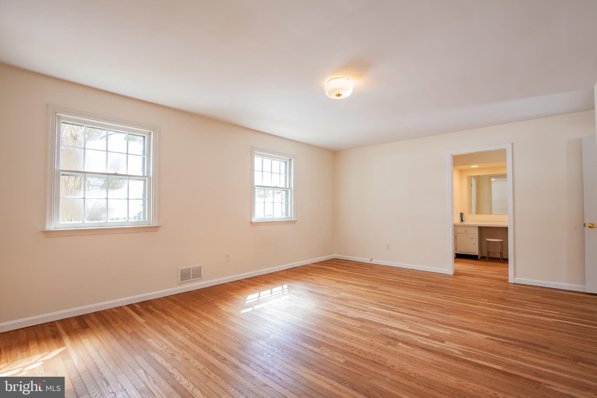 771 Richards Road Wayne, PA 19087 - Photo 23 of 41 a view of an empty room with wooden floor and a window