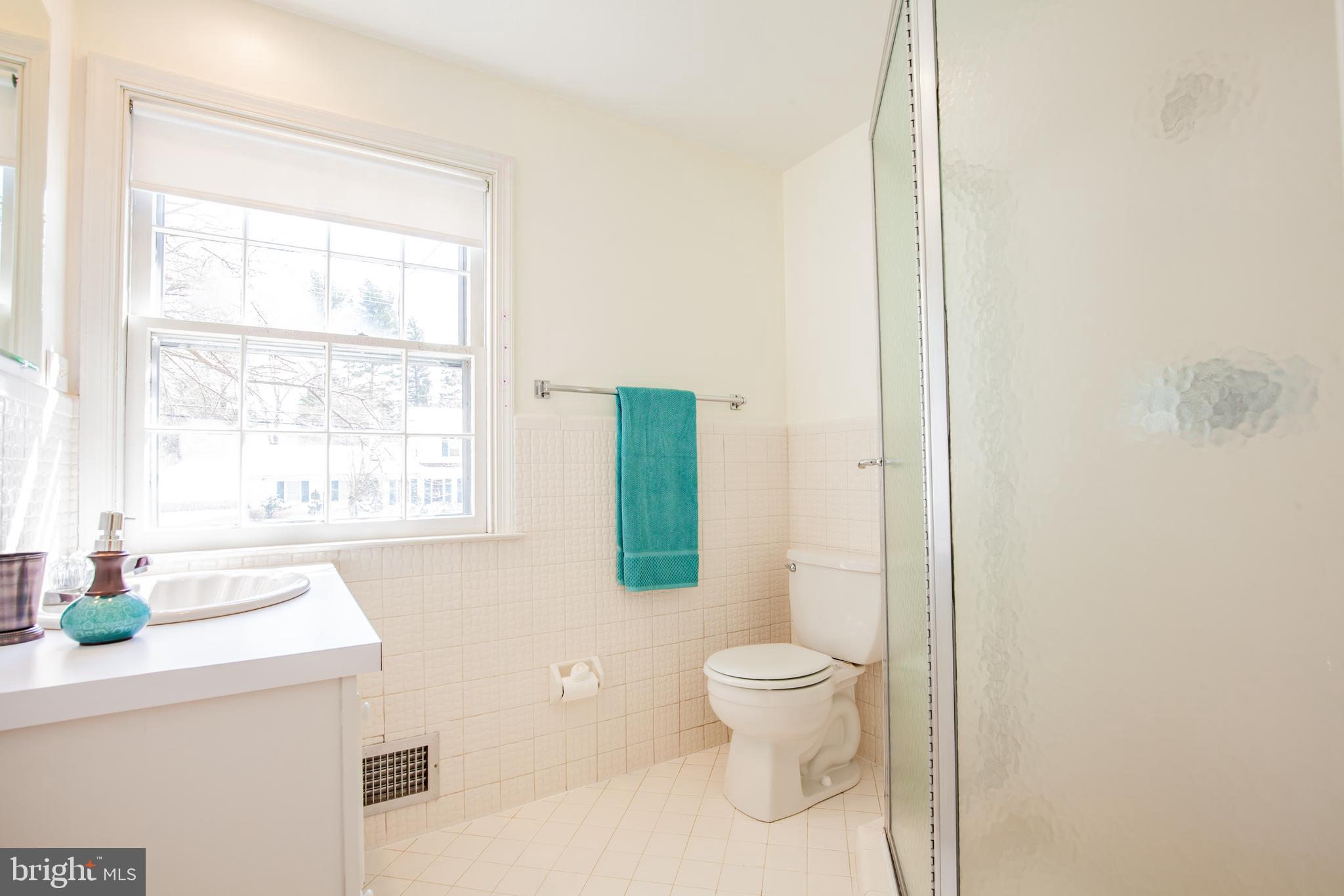 771 Richards Road Wayne, PA 19087 - Photo 26 of 41 a bathroom with a toilet sink and window