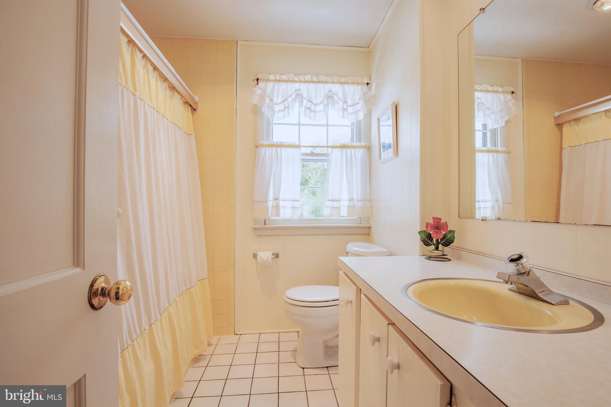 771 Richards Road Wayne, PA 19087 - Photo 28 of 41 a bathroom with a sink double vanity mirror and a toilet