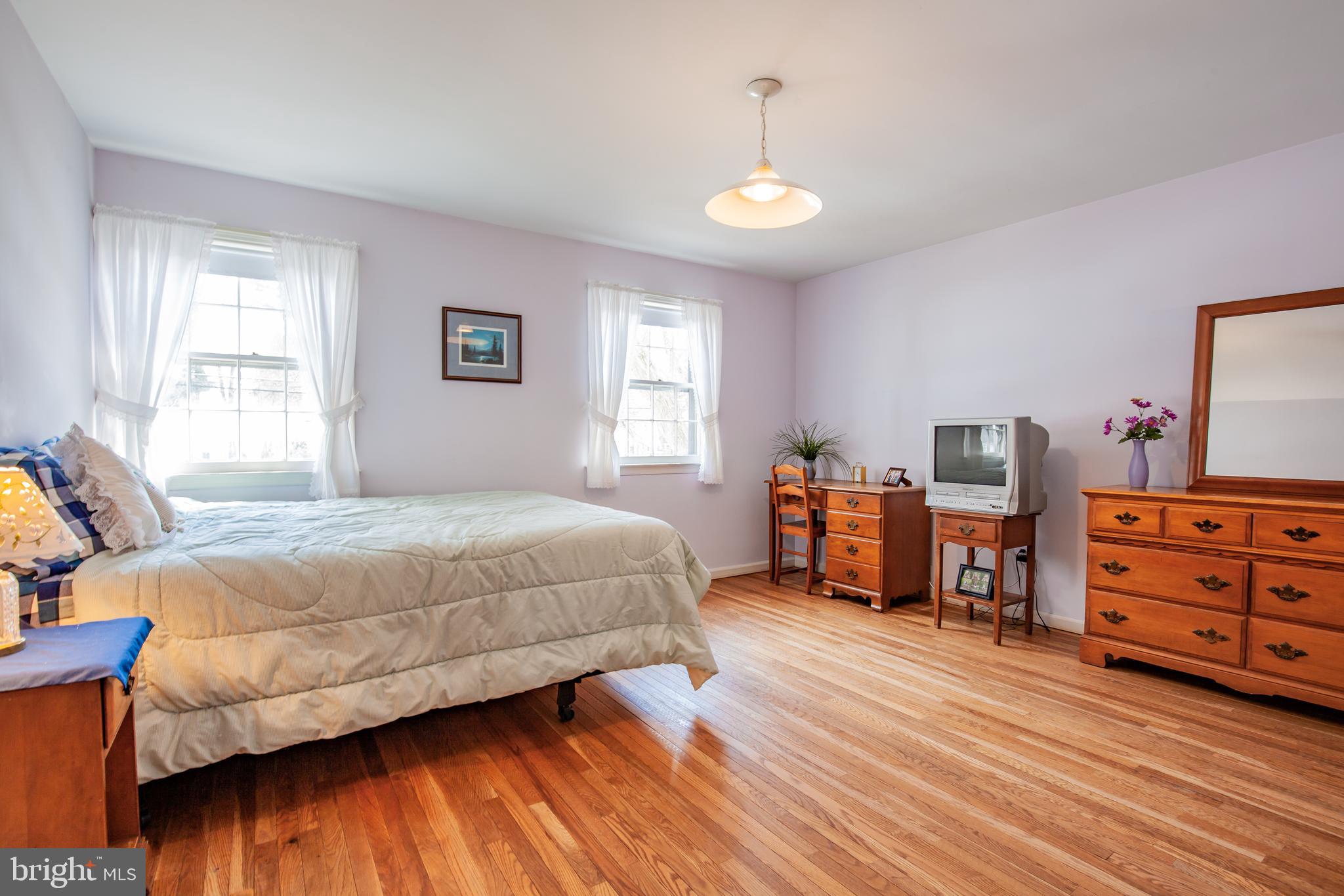 771 Richards Road Wayne, PA 19087 - Photo 31 of 41 a bedroom with a bed and wooden floor