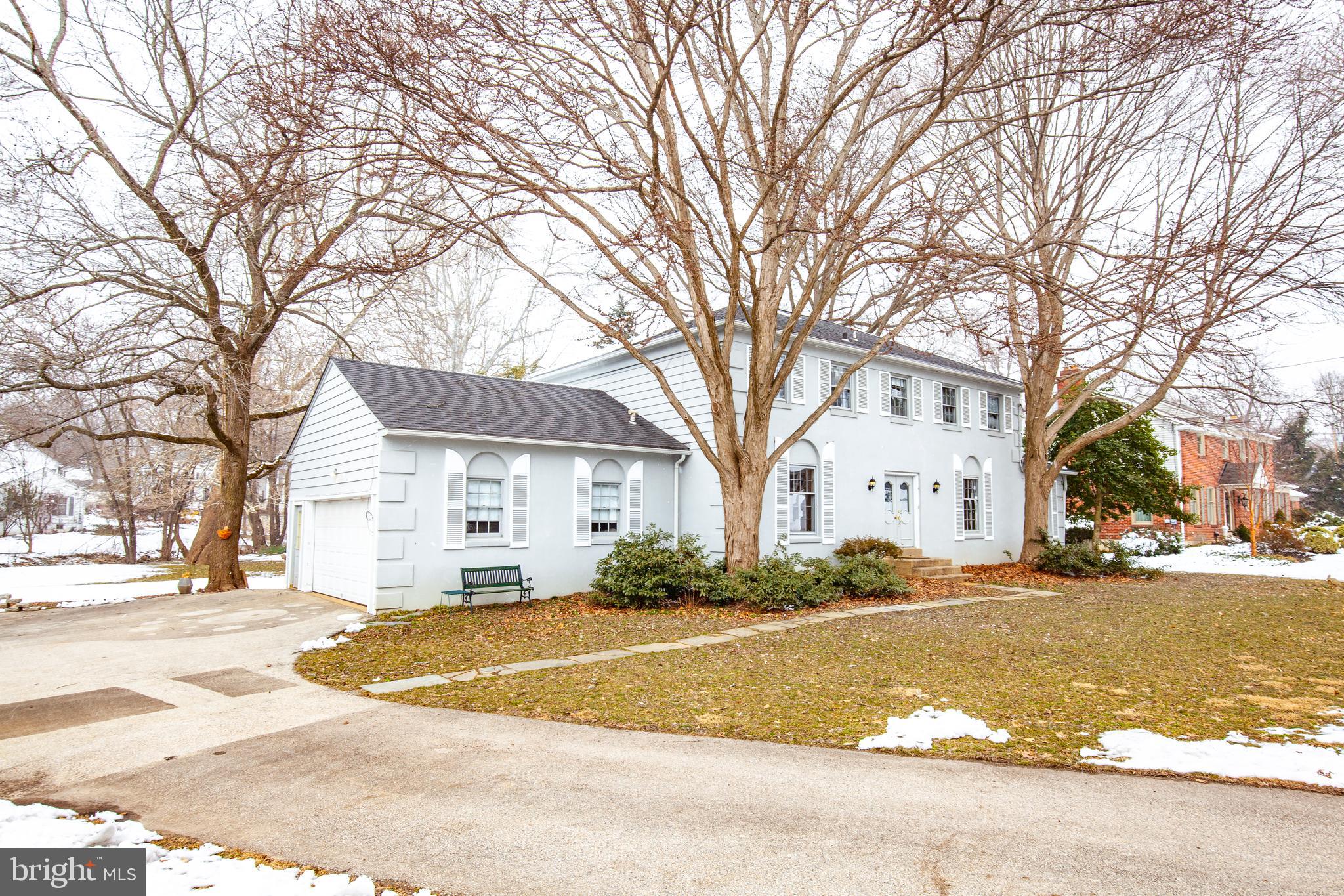 771 Richards Road Wayne, PA 19087 - Photo 4 of 41 a view of a white house with a yard covered with snow and a tree