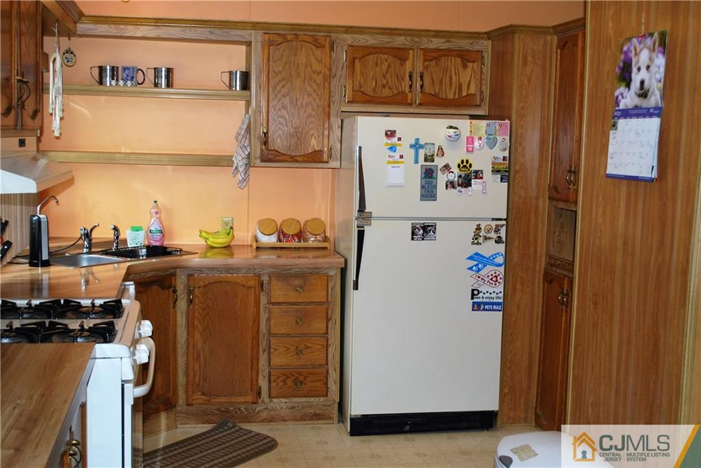 23 Poe Road, Unit 23 North Brunswick, NJ 08902 - Photo 15 of 16 a utility room with dryer and washer