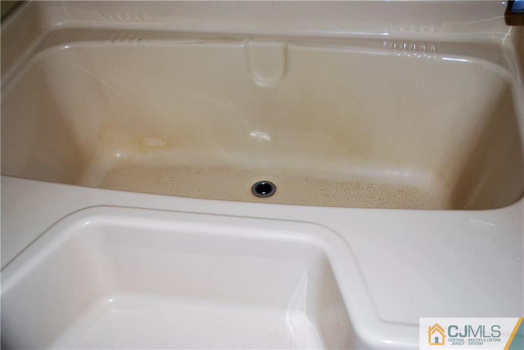 23 Poe Road, Unit 23 North Brunswick, NJ 08902 - Photo 9 of 16 a view of a bathtub in a bathroom