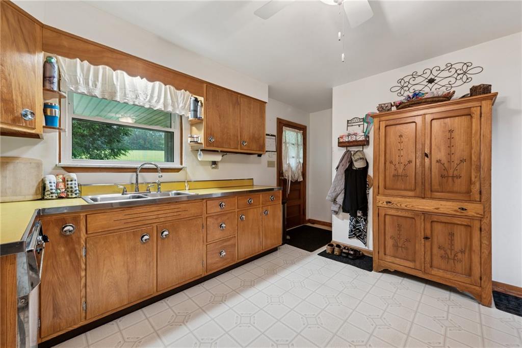 234 Ankney Hl Road Acme, PA 15610 - Photo 11 of 47 a kitchen with stainless steel appliances granite countertop a refrigerator and a sink