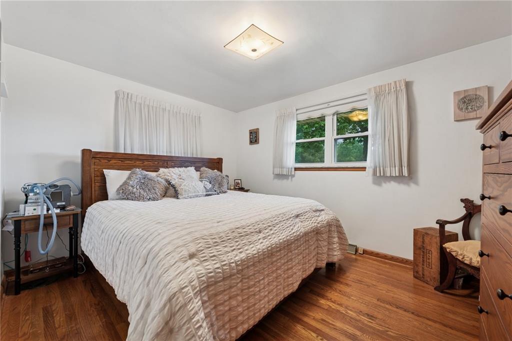 234 Ankney Hl Road Acme, PA 15610 - Photo 13 of 47 a bed sitting in a bedroom next to a window